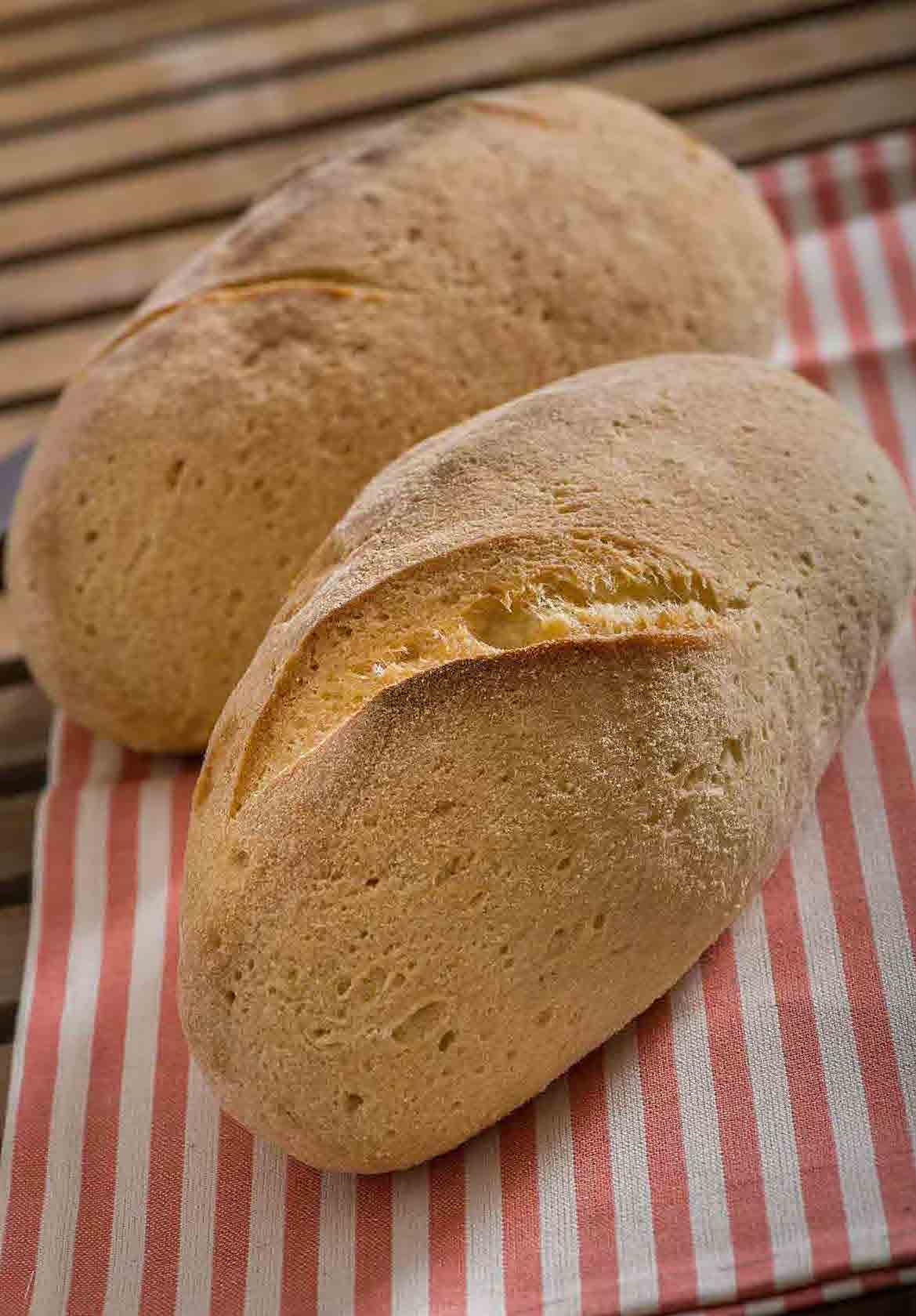 Hand-carved gluten-free loaf of bread