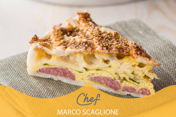 Savory gluten-free cake with zucchini, salamini and mozzarella breaded with sesame