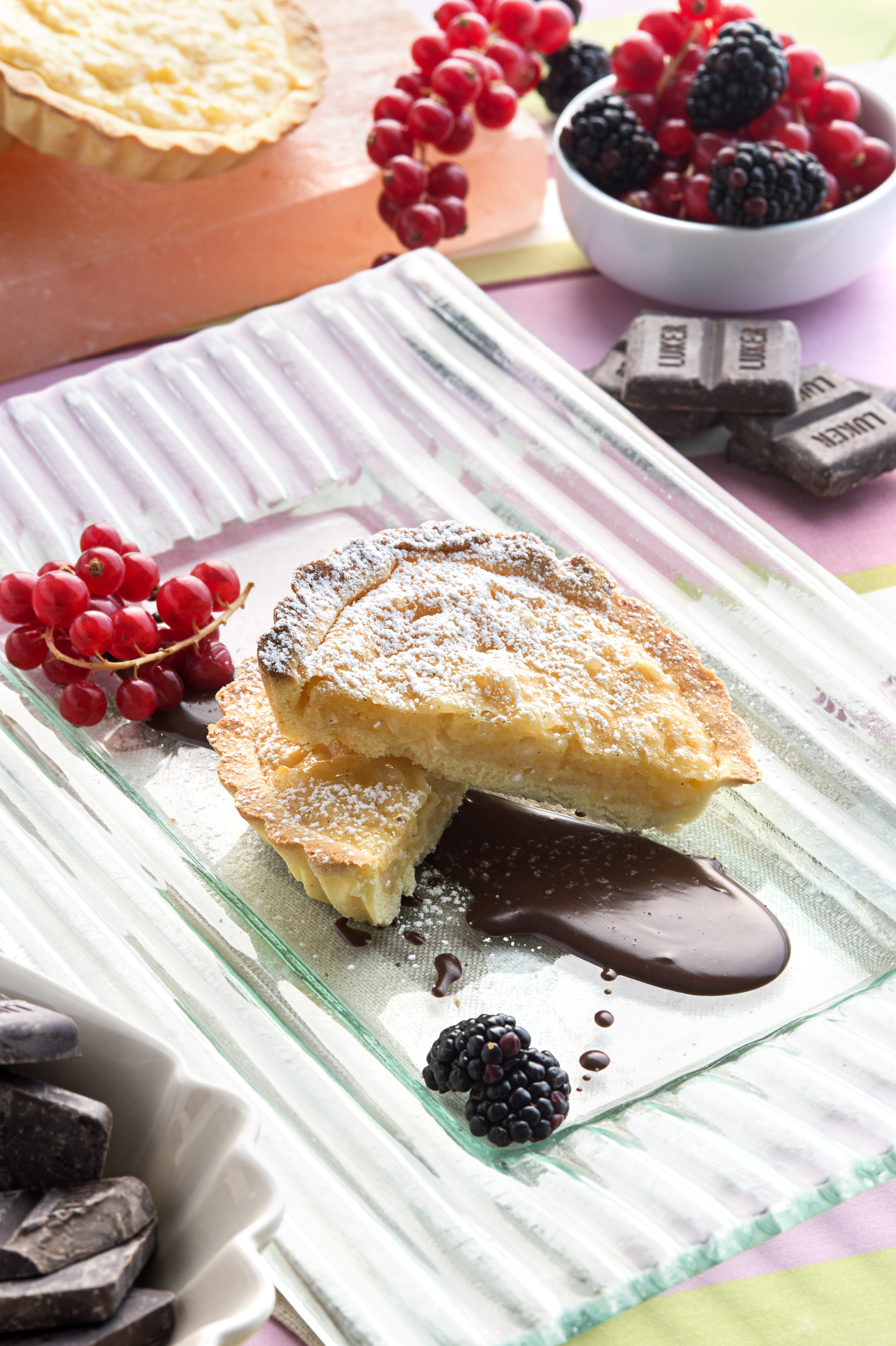 Gluten-free rice tart with custard and rum chocolate sauce