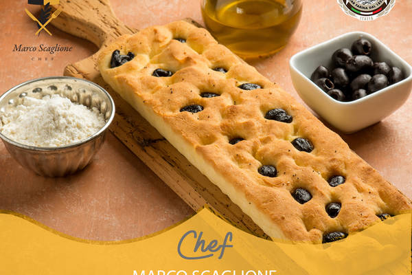 Gluten-free focaccia with olive oil and black olives 