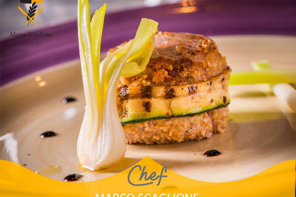 Breaded pork fillet with piedmont igp hazelnuts, grilled zucchini and scalded spring onion