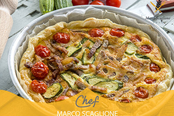 Savory cake with zucchini, cherry tomatoes and pillow