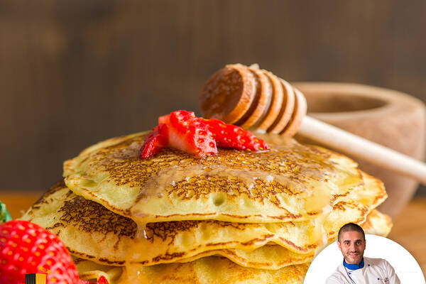 Pancakes with honey and strawberries