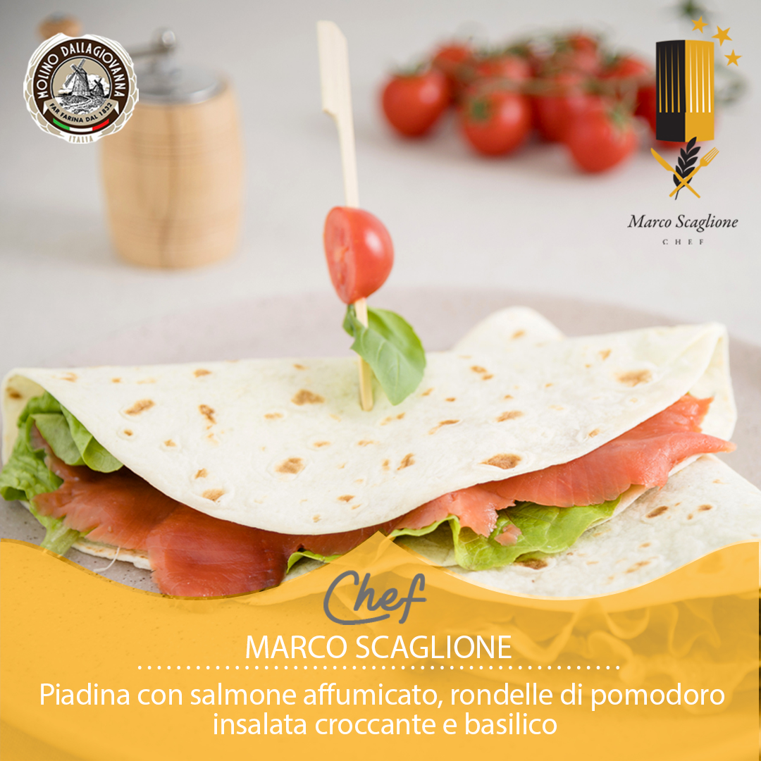 Piadina with smoked salmon, tomato slices, crispy salad and basil